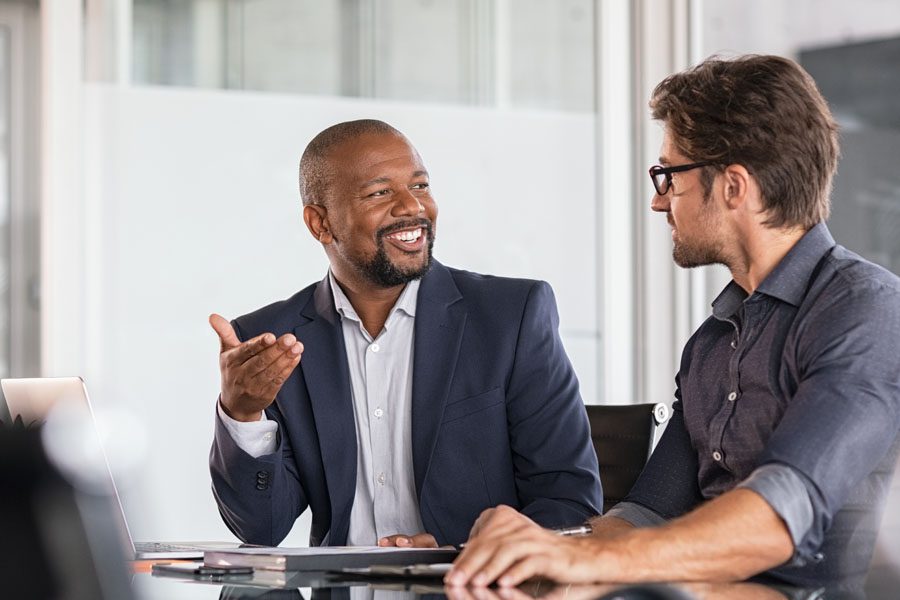 Our-Business-Partners-Group-of-Co-Workers-Sitting-an-Engaging-in-Best-Business-Practices